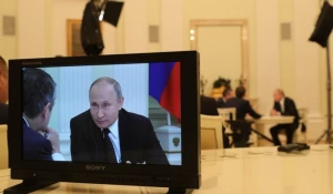 На экране монитора - Владимир Путин.