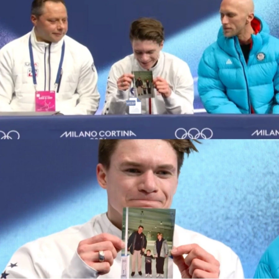 Фигурист Максим Наумов с фотографией своих родителей.